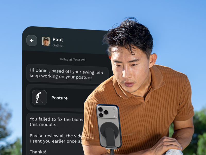 Man using a smartphone with a text conversation in a Golf Daddy app displayed on the screen