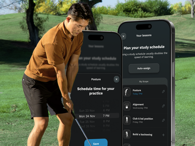 Man playing golf with two smartphones displaying a golf app on a golf course.