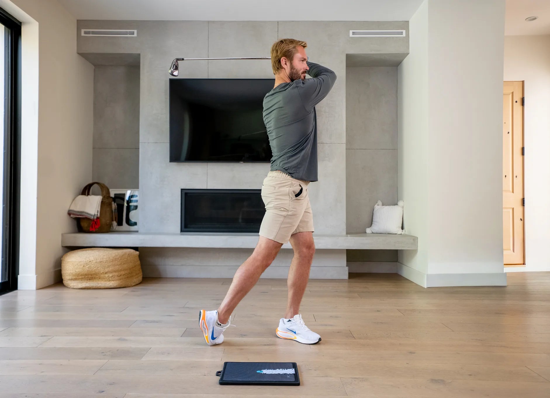 Swinging on the mat in the living room