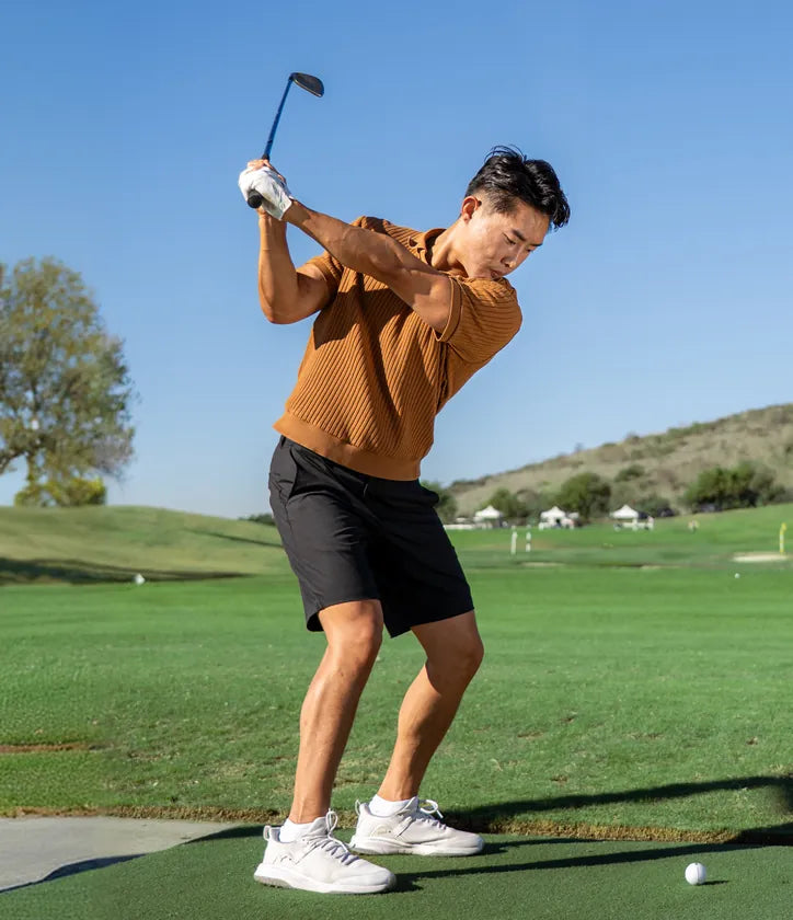 On demand: a golfer mid-swing on the range