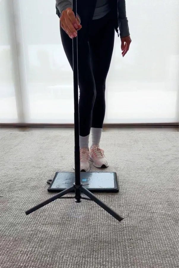 Tap the tripod's base to open the legs
